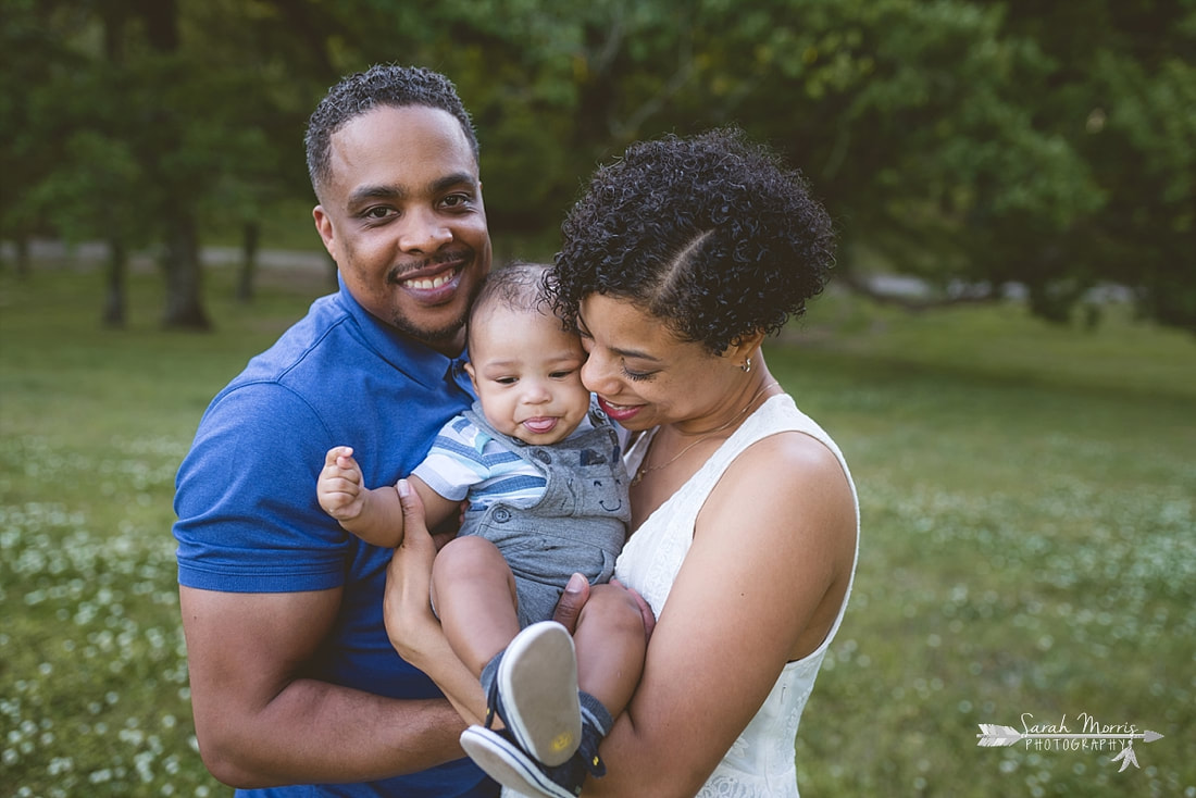 Family pictures in a field of clover at Shelby Farms Park