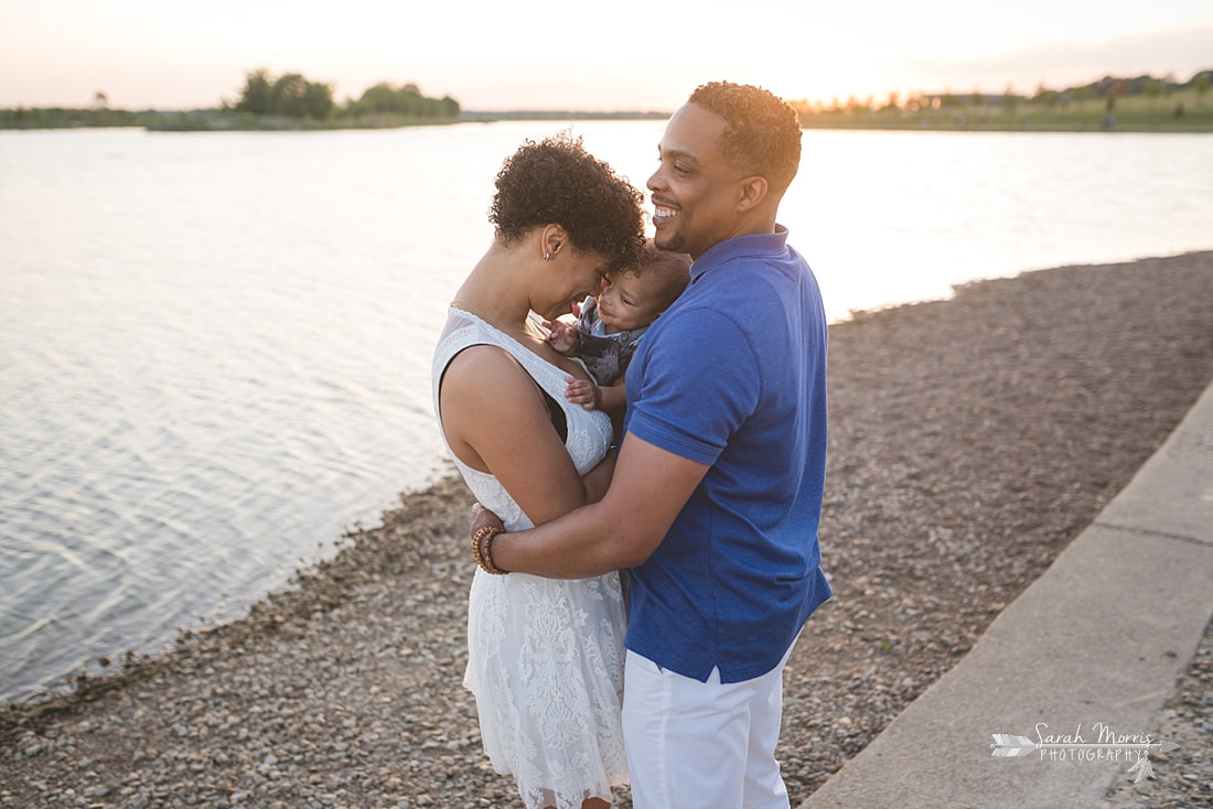 Family pictures on the bank of Patriot Lake at sunset at Shelby Farms Park