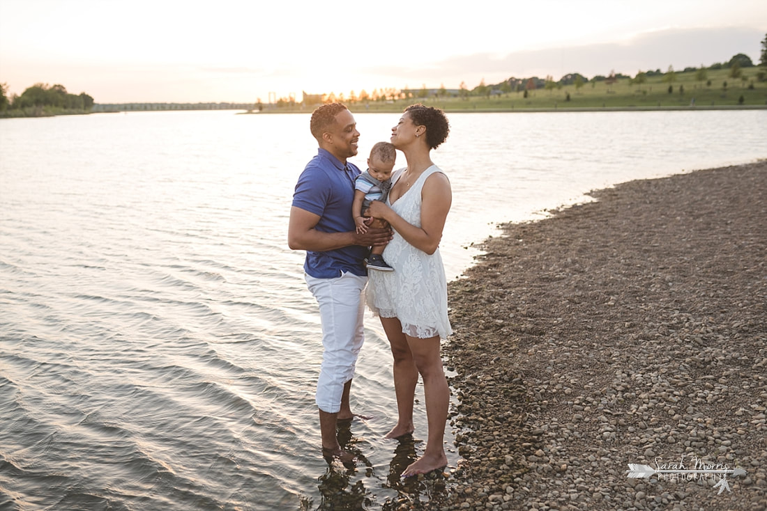 Family pictures on the bank of Patriot Lake at sunset at Shelby Farms Park