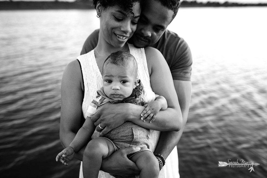 Family pictures on the bank of Patriot Lake at sunset at Shelby Farms Park