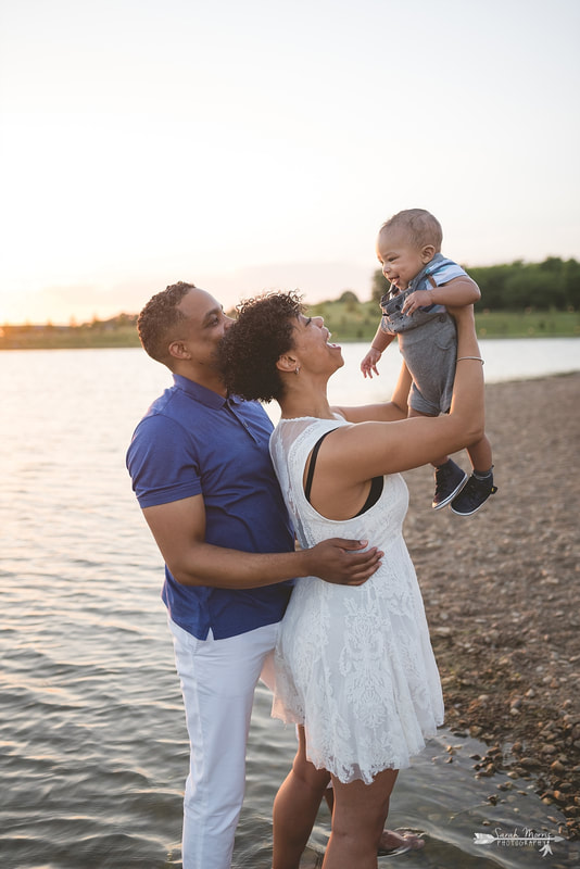 Family pictures on the bank of Patriot Lake at sunset at Shelby Farms Park