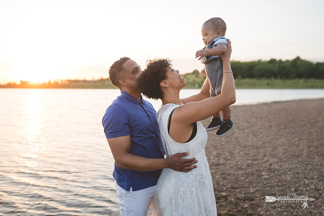 Family pictures on the bank of Patriot Lake at sunset at Shelby Farms Park