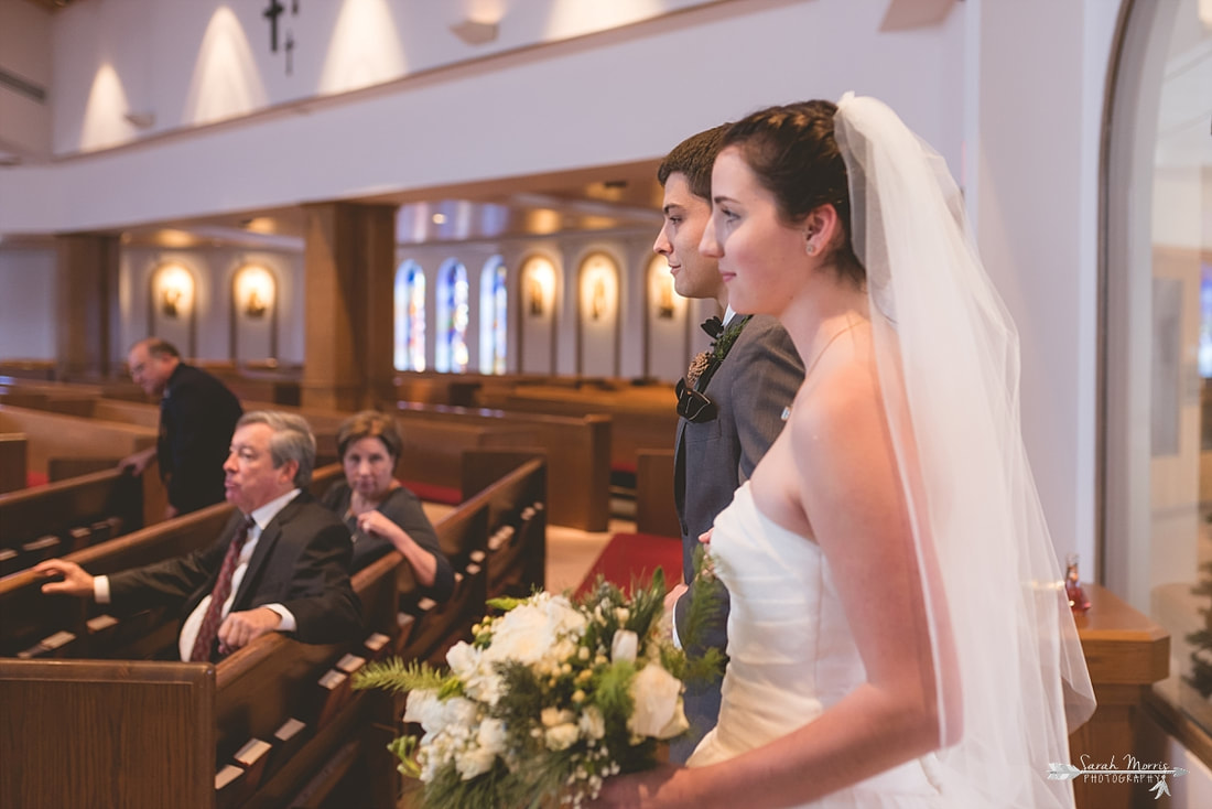 walking down the aisle at St. Francis of Assisi Catholic Church