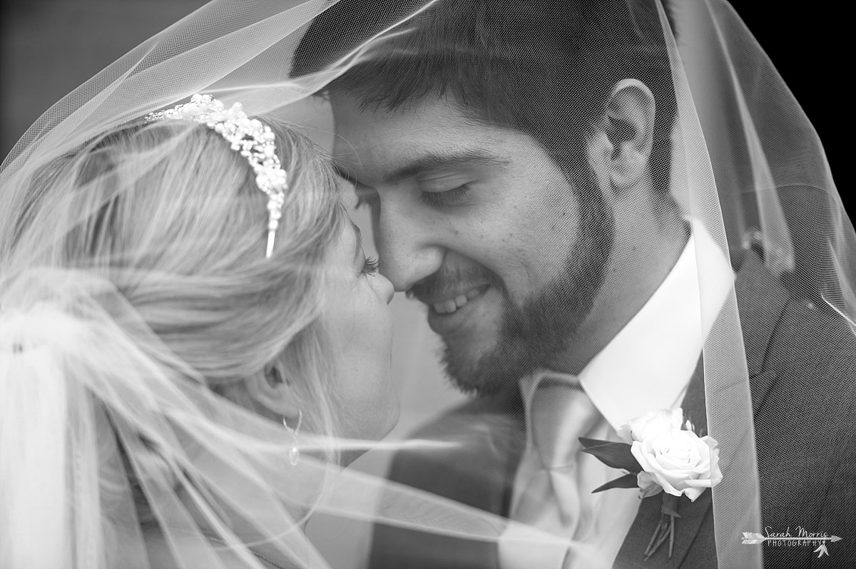 Bride and Groom under wedding veil at Annunciation Greek Orthodox Church in Memphis, TN